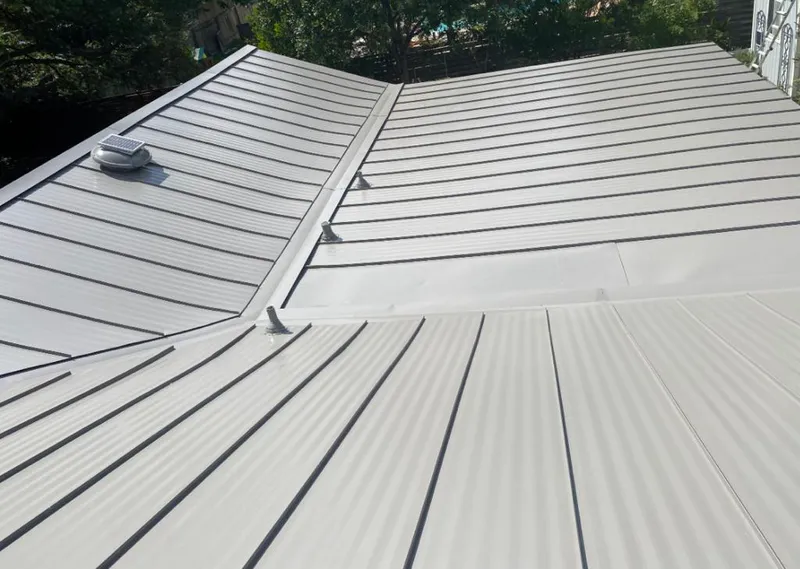 Solar attic fan installed on a metal roof for Roof Ventilation in Crown Point